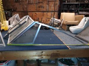 lot 72 image: Older glass windshield application from an older Larson. Came of