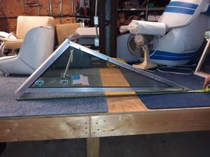 lot 77 image: Windshield off a fiberglass boat