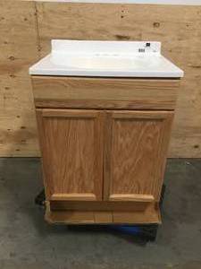 lot 18 image: Wooden cabinet from Lowes. Porcelain top.