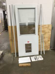 lot 84 image: Emco Wood core self storing and pet door.