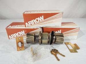 lot 75 image: Lot of 3 New Vintage Arrow Lock Corporation 551TP Antique Brass Keyed Door Knob Sets