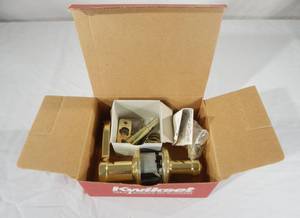 lot 81 image: New Kwikset 740CHL Polished Brass Locking Keyed Entrance Brass Door Lever Set