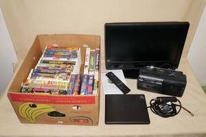 lot 77 image: Flat Screen TV, Disney VHS Movies