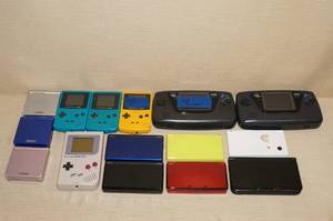 lot 102 image: BROKEN Video Game Handheld Systems
