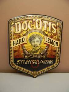 lot 73 image: DOC OTIS HARD LEMON TIN SIGN - APPROX 22 BY 18 - SEE PICTURES