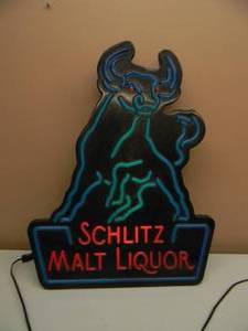 lot 76 image: SCHLITZ MALT LIQUOR LIGHTED BULL LIGHTSIGN - WORKS - APPROX 19 BY 24 - SEE PICTURES