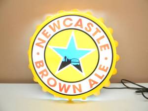 lot 101 image: NOS - NEWCASTLE BROWN ALE LIGHTED BOTTLE CAP SIGN - APPROX 19 - SEE PICTURES