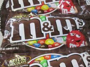 lot 230 image: 12 Bags of M&Ms Best by Aug 2020  ...