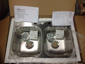 lot 95 image: American Standard 33-in x 22-in Stainless Steel Double Equal Bowl Drop-In 3-Hole Residential Kitchen Sink &nbspin good condition 