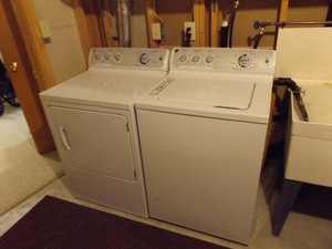 lot 54 image: General Electric 7 cu. ft. Gas Dryer and 3.8 DOE cu. ft. Washer Set