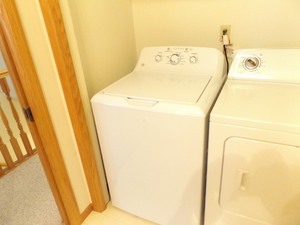 lot 61 image: GE 3.8 cu. ft. Stainless Drum Washing Machine Model #GTW330ASKWW