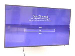 lot 65 image: Wall Mounted Samsung 55 Smart TV Model #UN55KU6290FXZA with Remote