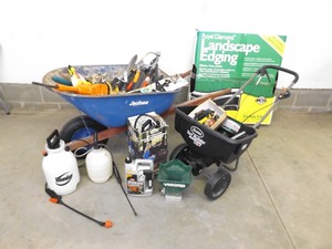 lot 172 image: Wheelbarrow and Spreader Full of Misc Lawn and Garden Tools