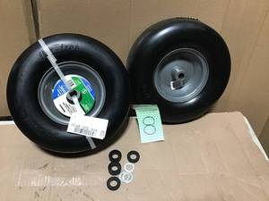 lot 8 image: Arnold 13 in. x 5 in. Universal Flat Free Zero Turn Front Wheel Assembly with Smooth Tread in good condition