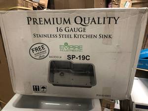 lot 109 image: Empire Industries Empire Undermount 16-Gauge Stainless Steel 32 in. Single Bowl Kitchen Sink with Grid and Strainer not used