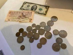 lot 53 image: International Currency and a Two Dollar Bill
