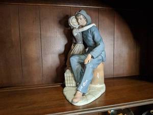 lot 130 image: Lladro Porcelain Figure - Man and Woman with Lantern