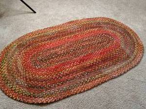 lot 192 image: Vintage red braided rug