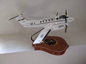 lot 551 image: Scale desk model of Air Force Super King Air 200.