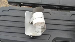 Two plastic gun cases and a fish house lp light
