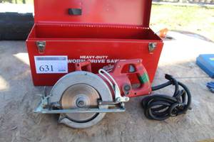 lot 631 image: Milwaukee Heavy Duty Worm Drive Saw, Blades, Metal Case