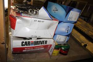 lot 699 image: Hubcap Sets (x2), Side Mirrors (x4 Boxes), Misc. Automotive Parts
