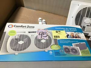 lot 45 image: Comfort Zone 9 in. Twin Window Fan with Manually Reversible Airflow Control in good condition