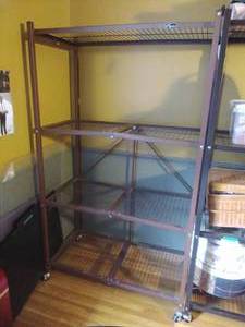 lot 74 image: Metal Origami Rolling Shelf