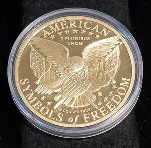 lot 08 image: GOLD OVER STERLING SILVER LIBERTY IN AIRTITE (27grams 92.5% sterling silver gold plated)