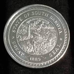lot 32 image: 1 TROY OZ. .999 FINE SILVER SOUTH DAKOTA 1889-1989