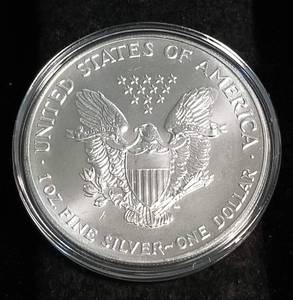 lot 36 image: 1993 AMERICAN SILVER EAGLE 1 TROY OZ. .999 FINE SILVER IN AIRTITE