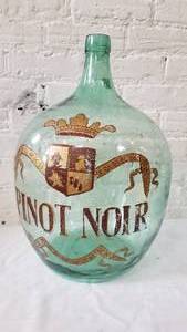 lot 43 image: Extra Large Old Bubble Glass Wine Jug with Grape Stomping Bucket