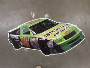 lot 110 image: Dale Jarrett Interstate Batteries Tin Sign 42x25