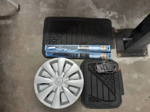 lot 131 image: 1-Set Of Floor Mats, 2-Set Wiper Blades, Set Of 4 Toyota 15 Wheel Covers