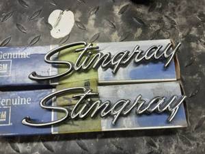 lot 136 image: NOS 2-Corvette Stingray Emblems In Boxes