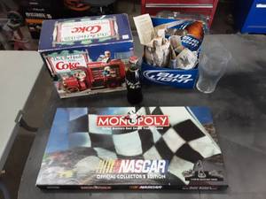 lot 183 image: 4 Pack Of Glasses From Bristol motor Speedway. Classic Bottle Of Coke, NASCAR Monopoly Game & Enesco Deck The Halls Vintage MusicalAction Delivery Truck Display Marked $199.95.