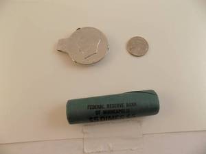 lot 104 image: 1972 Eisen Hower Money Clip, Roll of 1967 Dimes, 2004 Nickle