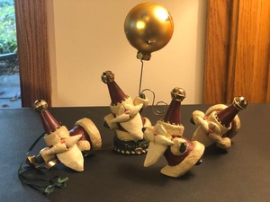 lot 57 image: Four Floating Santa Figurines