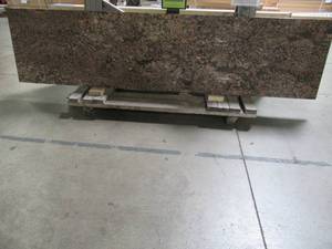 lot 404 image: Stone Source 3cm x 108 x 25.5 Madeira Granite Blank Countertop - Very Slight EdgeCorner Chips.