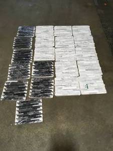 lot 4 image: BOX WITH 21 ASSORTED BLACKWHITE FLOORING SEE PICS