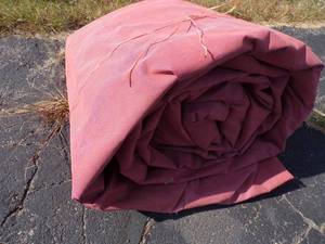 lot 61 image: Tarp may have holes or rips good for wood pile