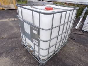 lot 79 image: 250 gallon Tote with Pallet.  Was used for Food Grade Material