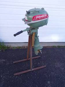 lot 88 image: Vintage Johnson Outboard Motor with stand