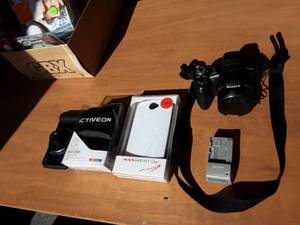 lot 42 image: Sony Cynershot Camera With Phone Case, Action Cam Head Strap, Moto-Mod Camera (Cell Phone Attachment)