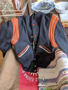 lot 462 image: A stylish jacket and rugs on a directors chair