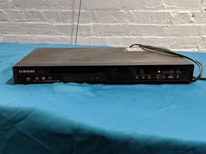lot 310 image: LARGE Lot of DVDs with DVD player