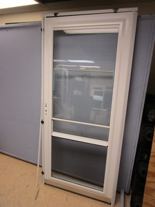 lot 810 image: PRO-VIA STORM DOOR - NEW