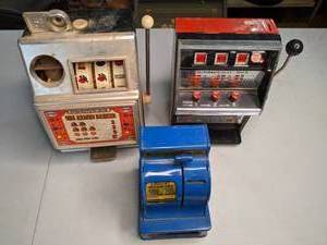 lot 243 image: Three Vintage Toy Slot Machines