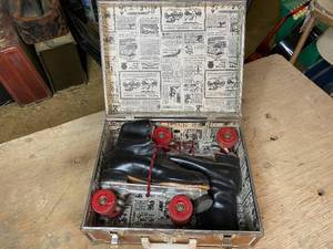 lot 134 image: Pair of Vintage Black Super X 7L Sure Grip Rollerskates in Carrying Case
