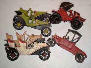 lot 12 image: Metal semi three dimensional old timey automobiles